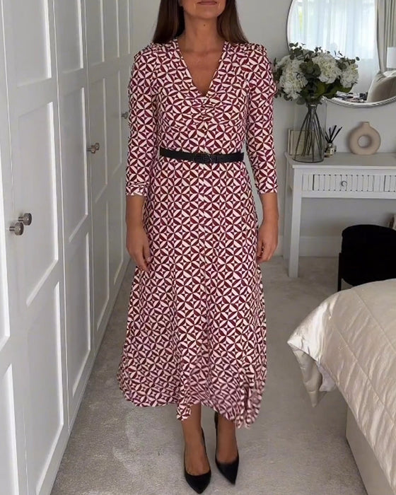 Elegancka sukienka z geometrycznym nadrukiem i dekoltem w kształcie litery V