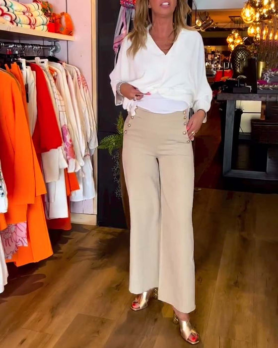 Wiązana bluzka z dekoltem w szpic