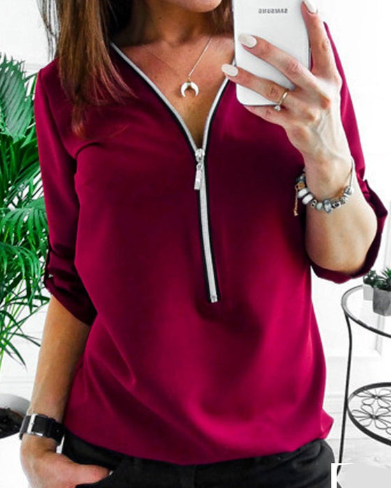 Solidna bluzka zapinana na zamek