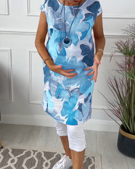 Długa bluzka w kolorowe kwiatowe wzory