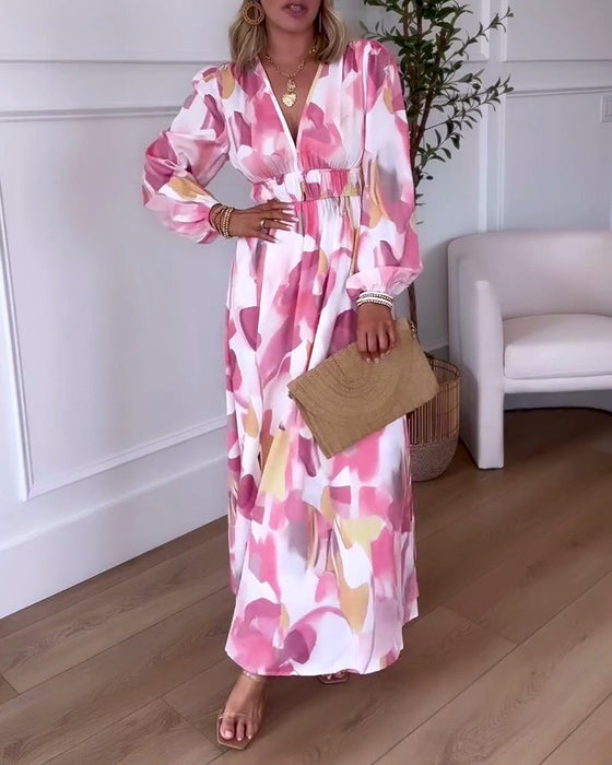 Elegancka sukienka maxi z nadrukiem z długim rękawem i dekoltem w kształcie litery V