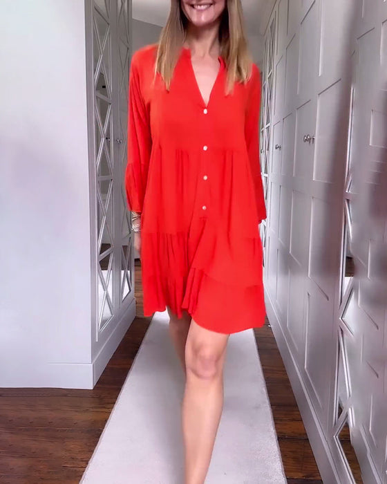 Sukienka w jednolitym kolorze z dekoltem w kształcie litery V rozkloszowana i z długimi rękawami