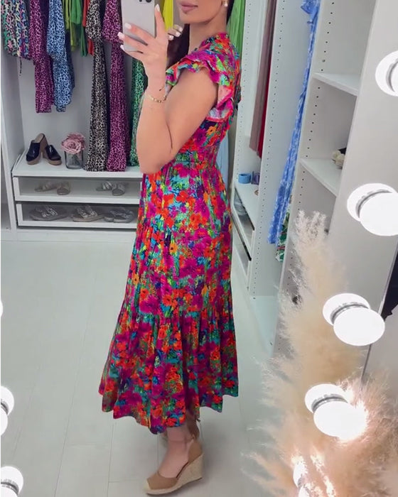 Elegancka sukienka z kolorowym kwiatowym nadrukiem i dekoltem w kształcie litery V
