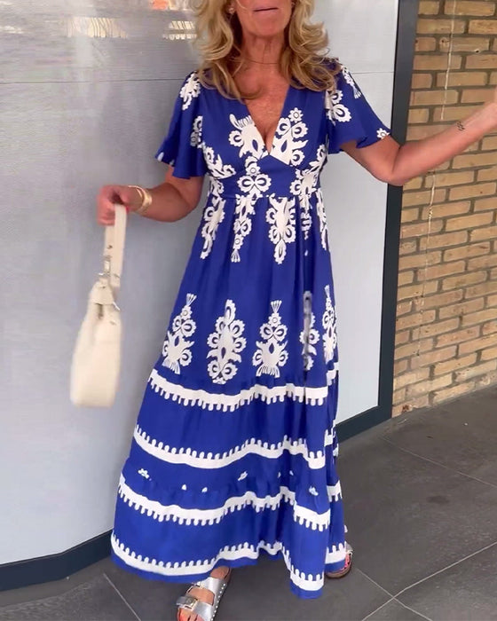 Elegancka długa sukienka w stylu vintage z dekoltem w kształcie litery V