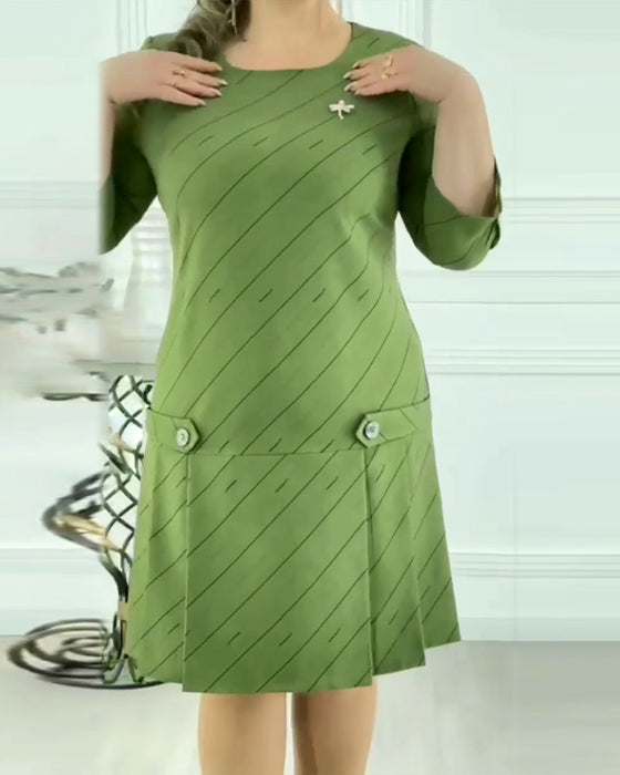 Elegancka sukienka z okrągłym dekoltem i nadrukiem