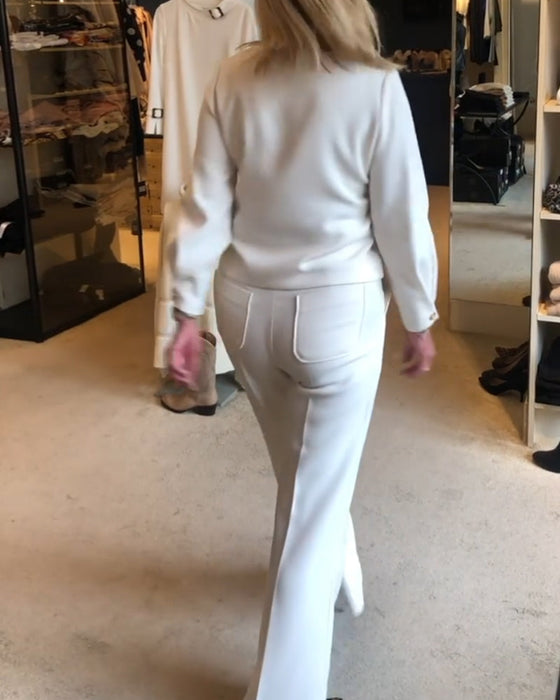 Elegancka bluzka w jednolitym kolorze z dekoltem w kształcie litery V