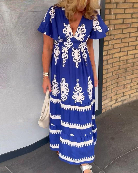 Elegancka długa sukienka w stylu vintage z dekoltem w kształcie litery V