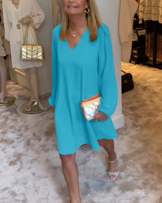 Sukienka w jednolitym kolorze z rękawami typu lampion i dekoltem w kształcie litery V