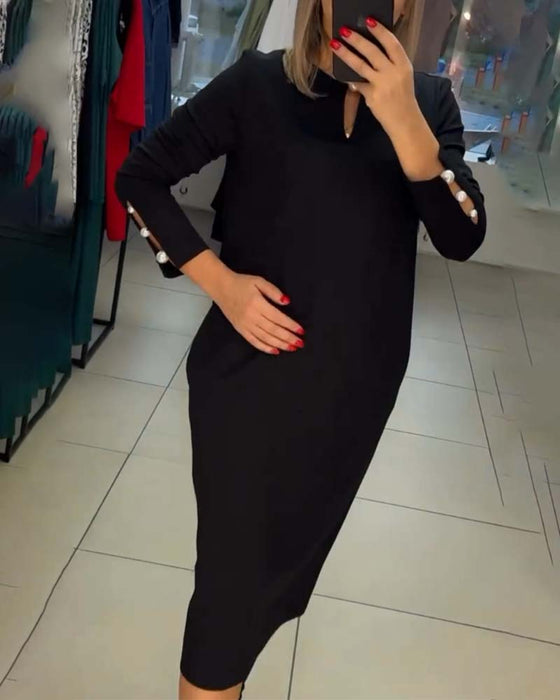 Elegancka sukienka zapinana na perłowe guziki