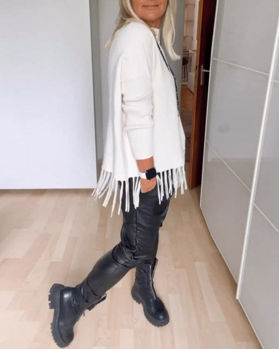 Sweter w jednolitym kolorze z frędzlami