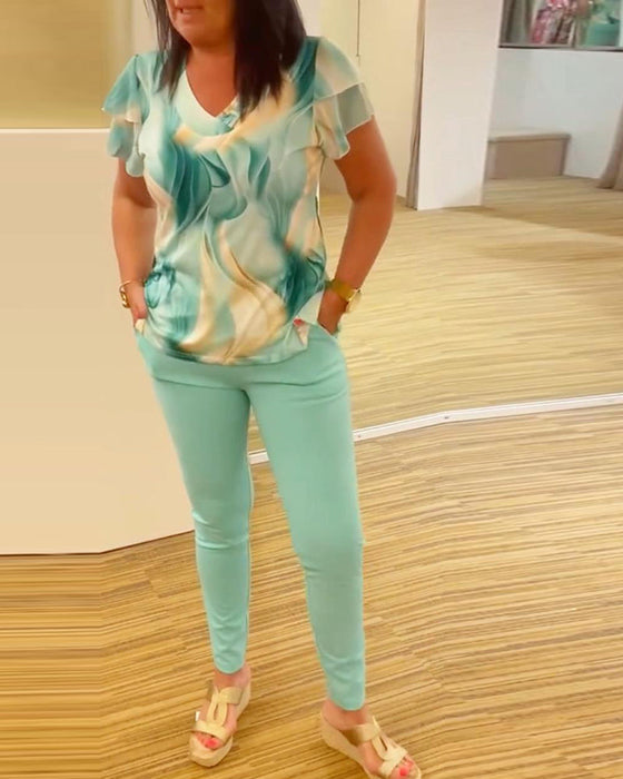 Patchworkowa bluzka z falbankami i nadrukiem z dekoltem w kształcie litery V