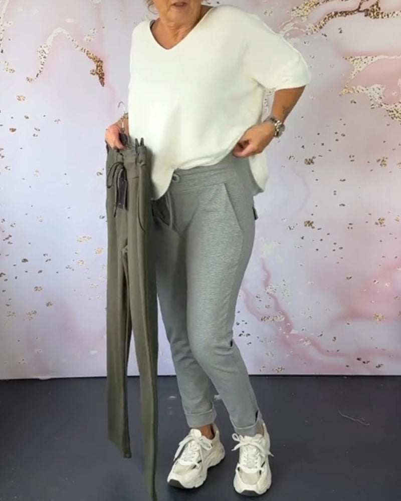 Spodnie casualowe w jednolitym kolorze z kieszeniami i ściągaczem