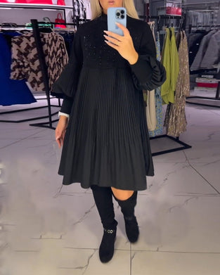 Sukienka z bufiastymi rękawami i stójką