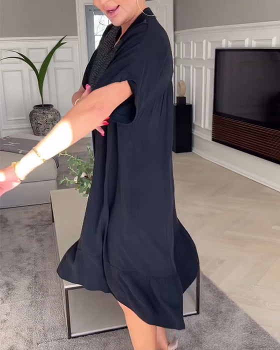 Luźna plisowana sukienka z dekoltem w kształcie litery V