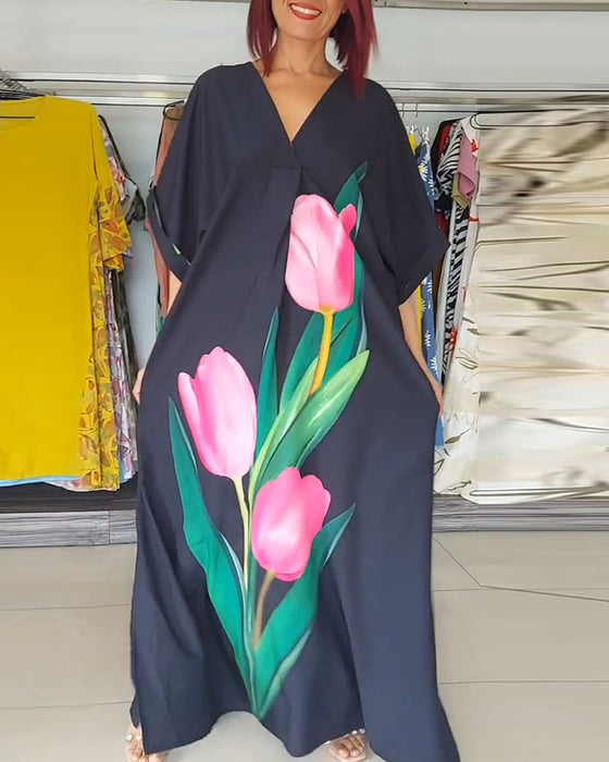 Długa sukienka z dekoltem w kształcie litery V i kwiatowym nadrukiem