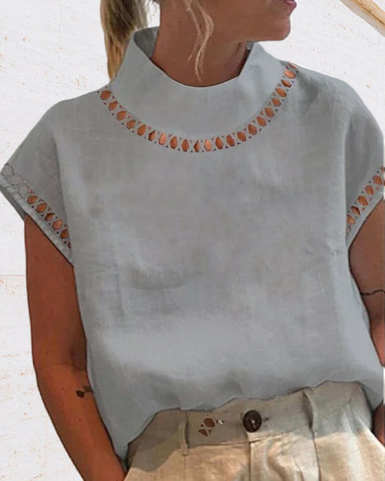 Bluzka ze stójką z koronki w jednolitym kolorze