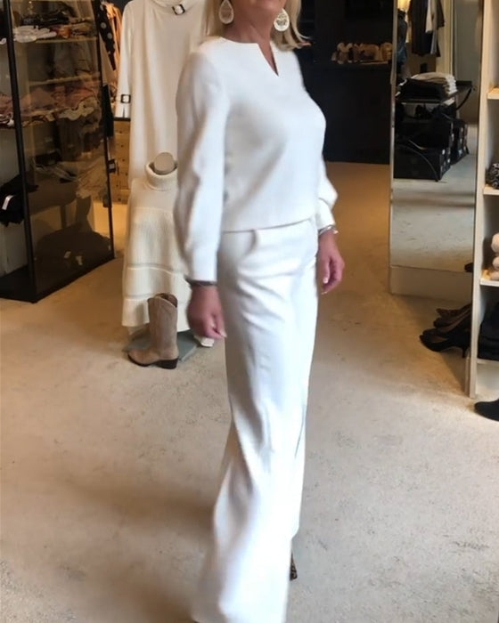 Elegancka bluzka w jednolitym kolorze z dekoltem w kształcie litery V