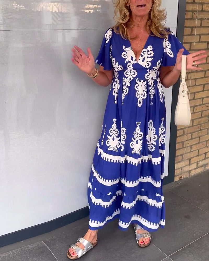 Elegancka długa sukienka w stylu vintage z dekoltem w kształcie litery V