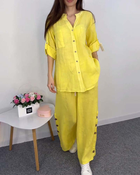 Koronkowa bluzka z kieszeniami i spodnie z szerokimi nogawkami w jednolitym kolorze