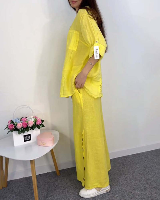 Koronkowa bluzka z kieszeniami i spodnie z szerokimi nogawkami w jednolitym kolorze