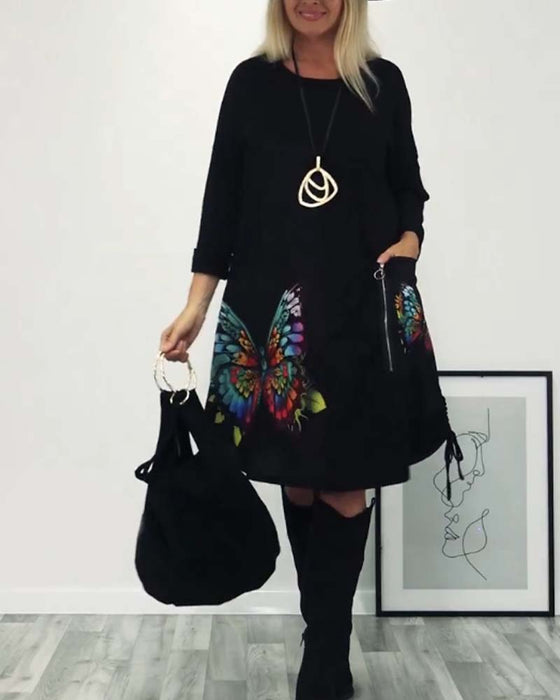 Długa sukienka z kieszeniami i nadrukiem motyli