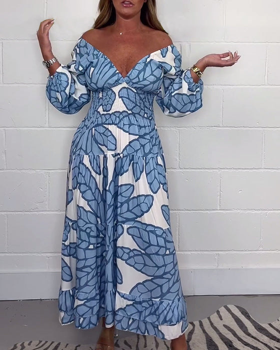 Długa damska sukienka z nadrukiem i dekoltem w kształcie litery V