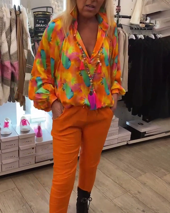 Damska bluzka z guzikami w kwiaty