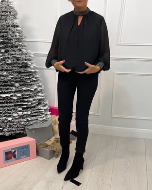 Modna bluzka w jednolitym kolorze ze stójką i patchworkowym