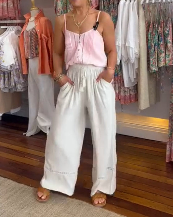 Jednokolorowe wygodne spodnie z szerokimi nogawkami i kieszeniami