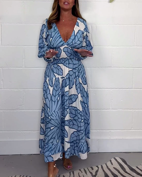 Długa damska sukienka z nadrukiem i dekoltem w kształcie litery V