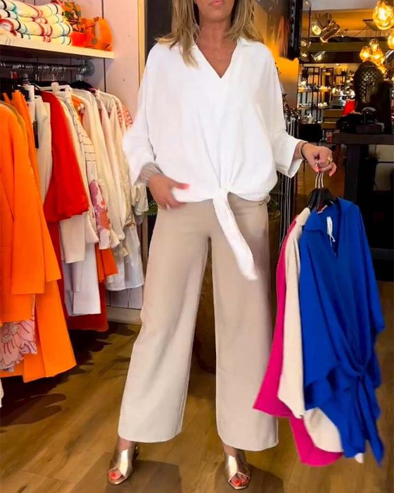 Wiązana bluzka z dekoltem w szpic