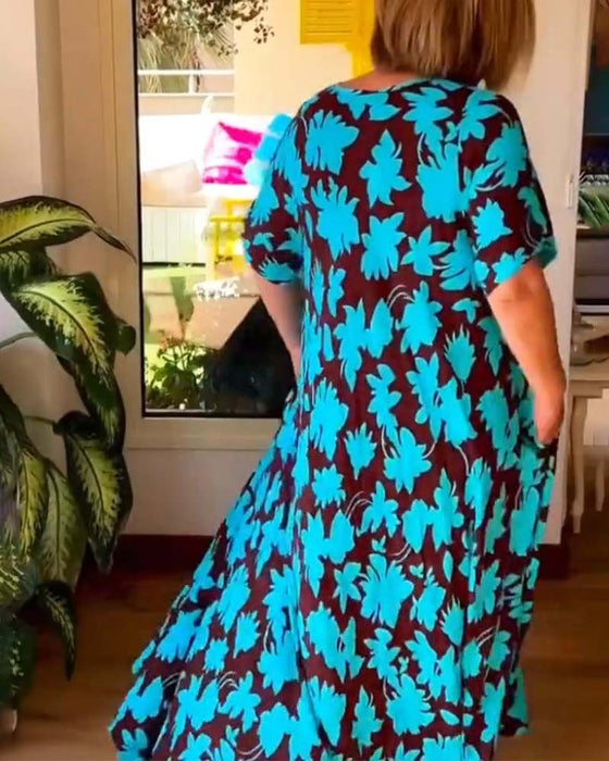 Luźna sukienka z kwiatowym nadrukiem i dekoltem w kształcie litery V