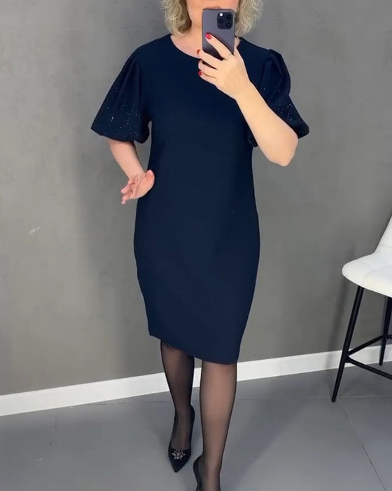 Elegancka sukienka z bufiastym rękawem i krótkim rękawkiem