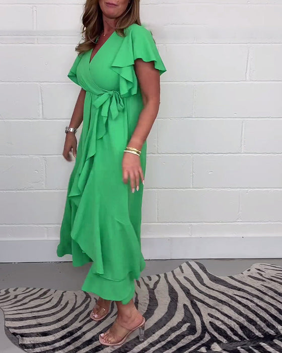 Elegancka sukienka z rozcięciem w jednolitym kolorze