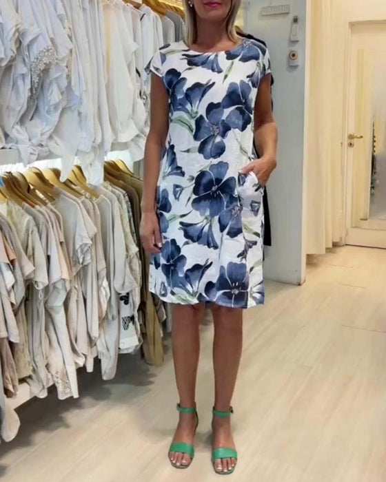 Sukienka z krótkim rękawkiem i kieszeniami w kwiatowy wzór