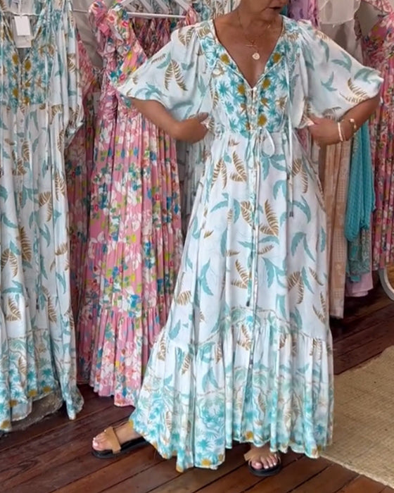 Damska sukienka maxi z dekoltem w kształcie litery V i nadrukiem w liście