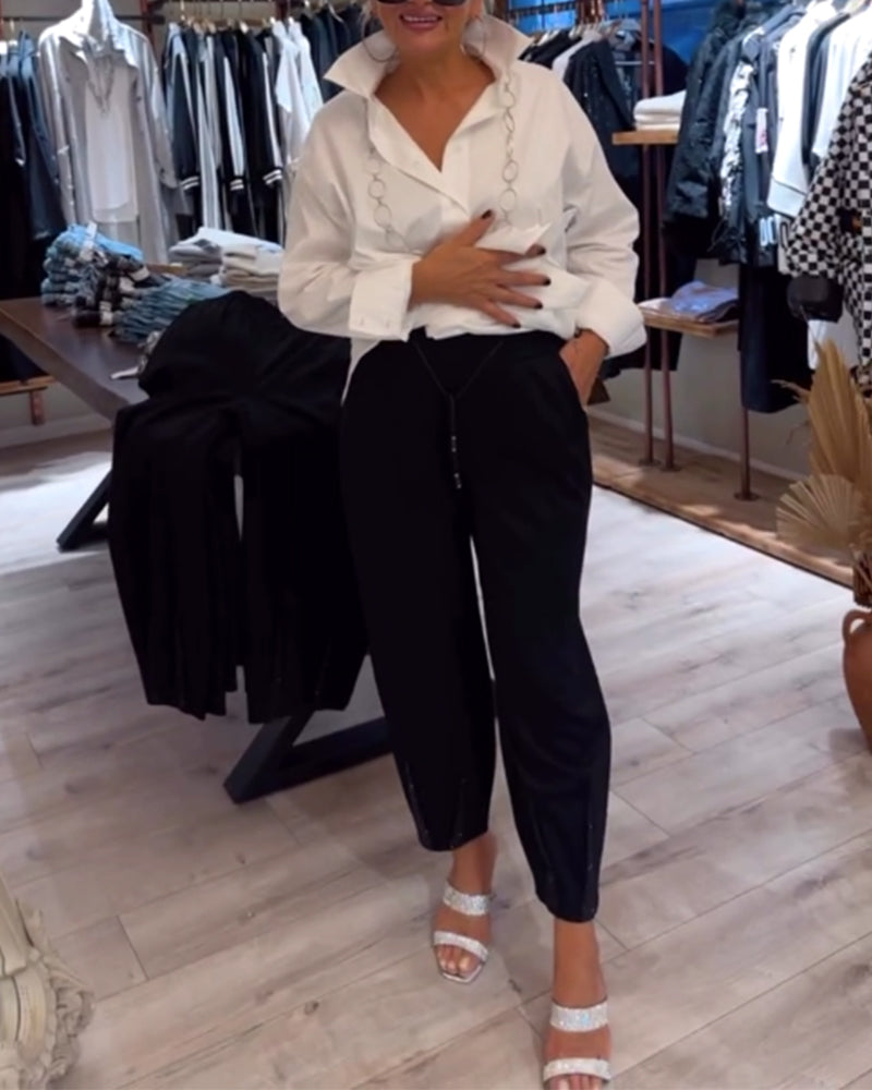 Spodnie w jednolitym kolorze ze ściągaczem i cekinami