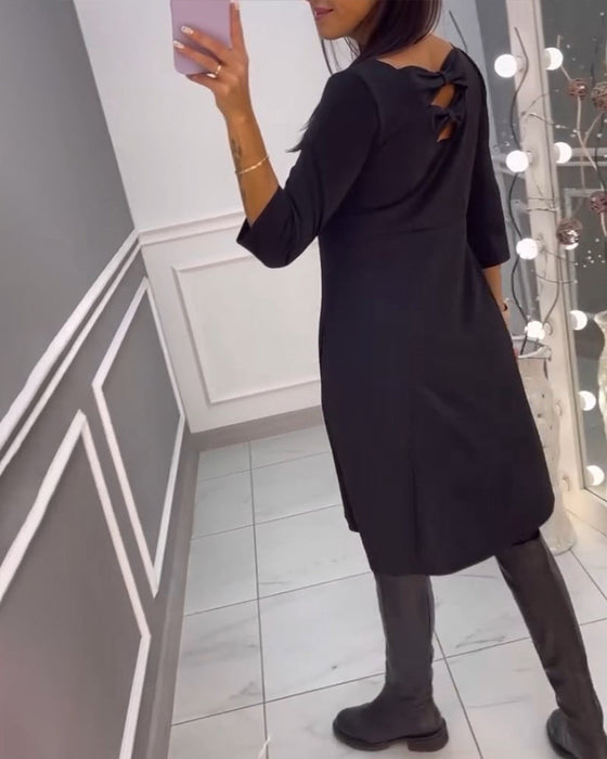 Sukienka w jednolitym kolorze z kokardą z tyłu