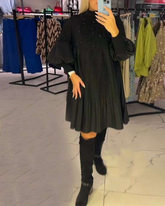 Sukienka z bufiastymi rękawami i stójką