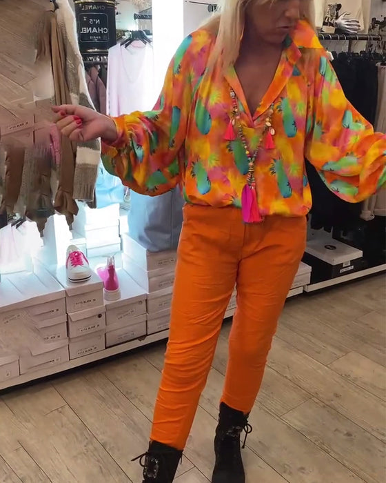 Damska bluzka z guzikami w kwiaty