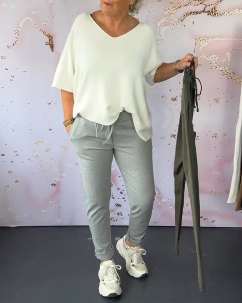 Spodnie casualowe w jednolitym kolorze z kieszeniami i ściągaczem