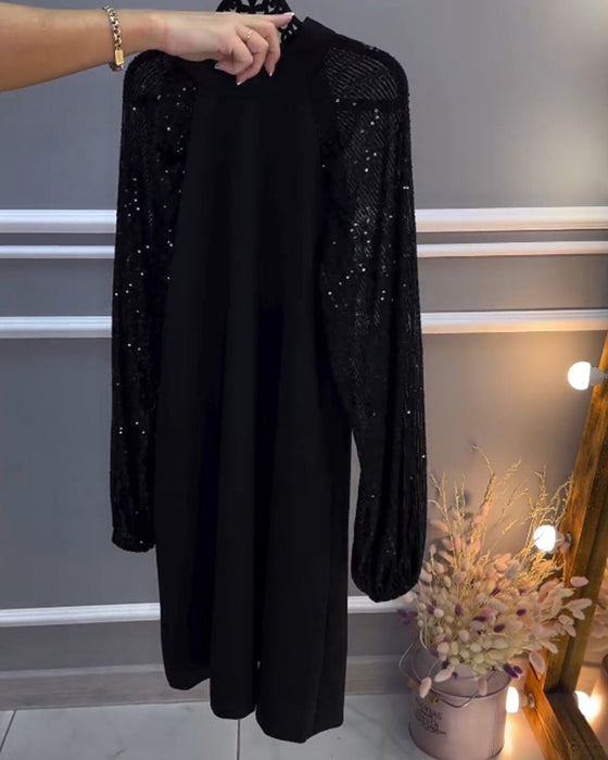 Sukienka w jednolitym kolorze z wstawkami na rękawach