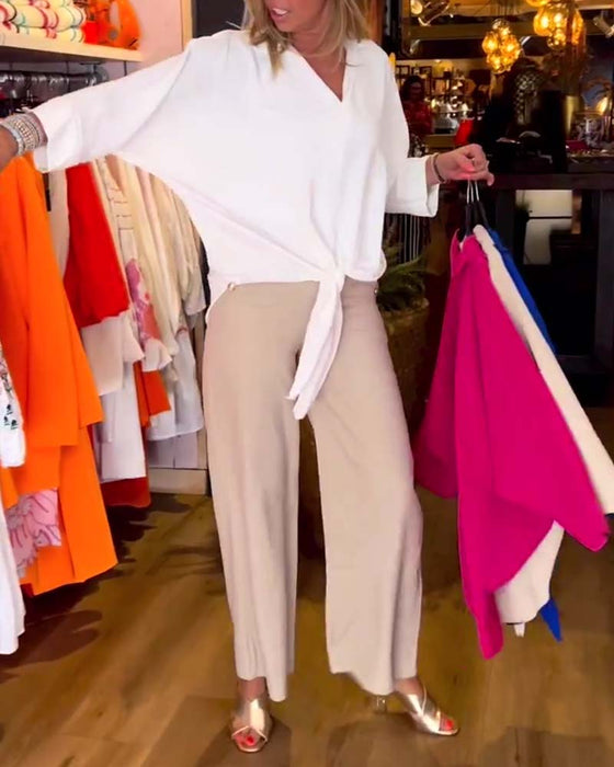 Wiązana bluzka z dekoltem w szpic