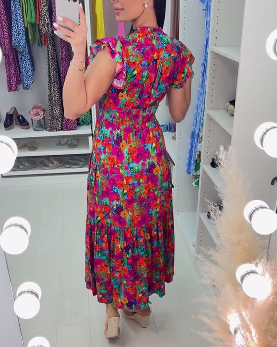 Elegancka sukienka z kolorowym kwiatowym nadrukiem i dekoltem w kształcie litery V