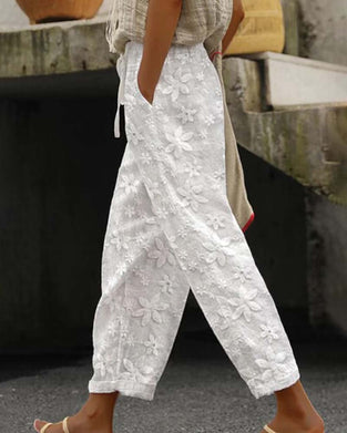 Sznurowane spodnie w jednolitym kolorze z kwiatowym haftem