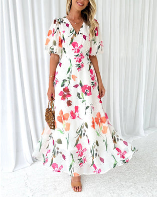 Elegancka sukienka z bufiastymi rękawami i kwiatowym nadrukiem