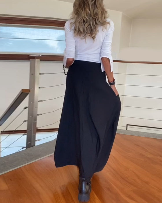 Modna jednokolorowa spódnica z kieszenią na suwak